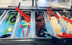 Our cafeteria’s appetizing salad bar, halfway through a lunch period. It’s worthy of a grocery store when it’s full.